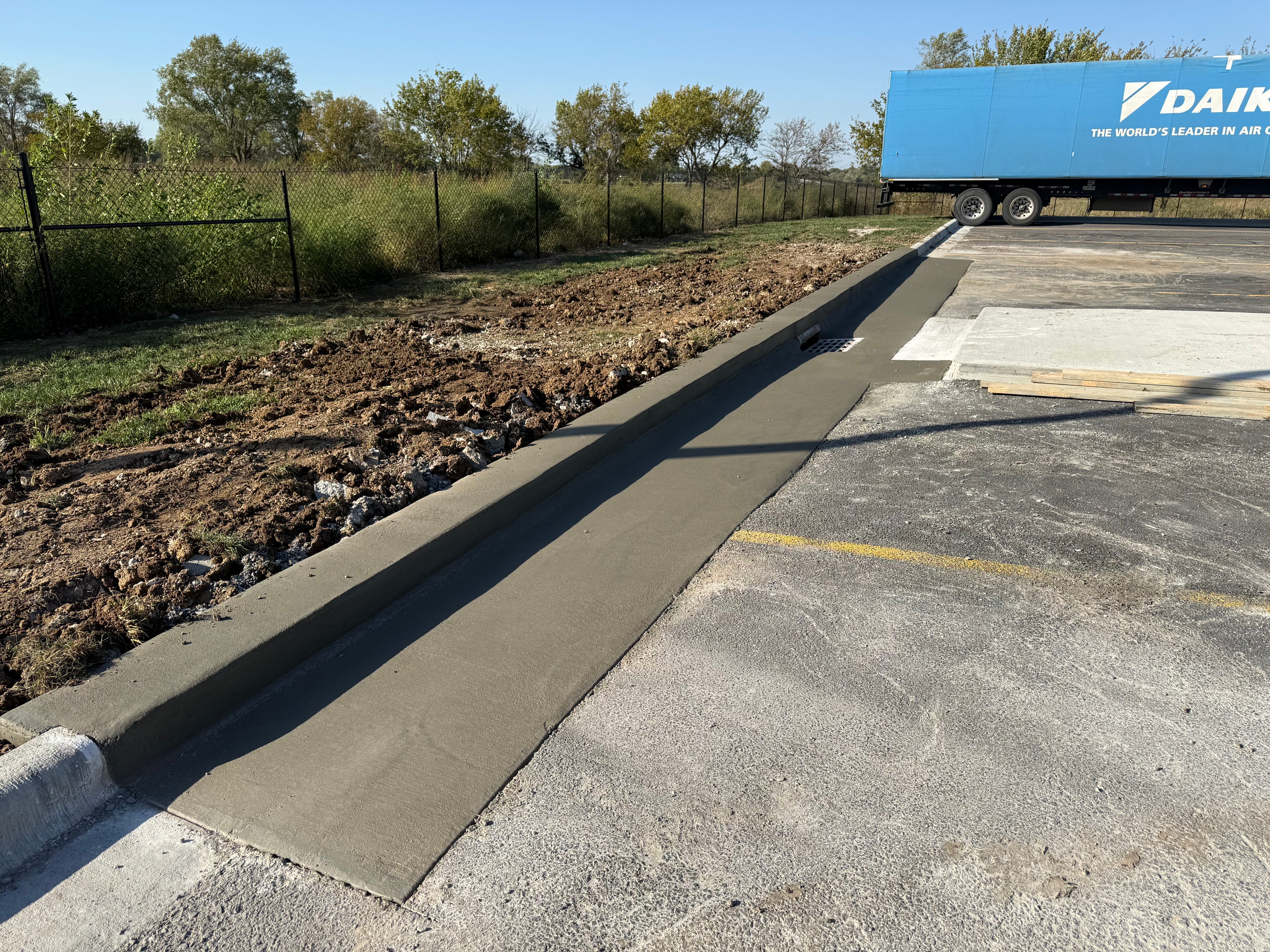 Fresh concrete curb and gutter installation