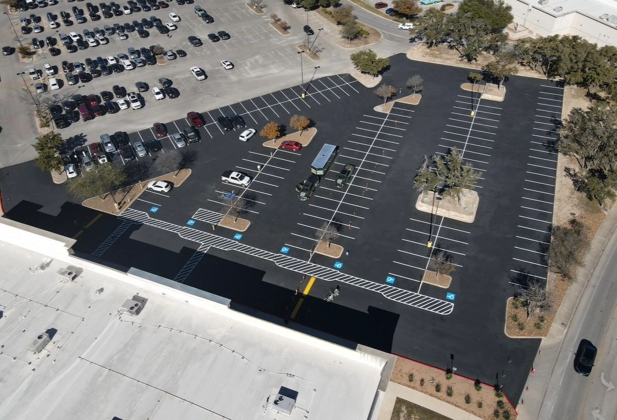 Aerial parking lot fresh asphalt striping